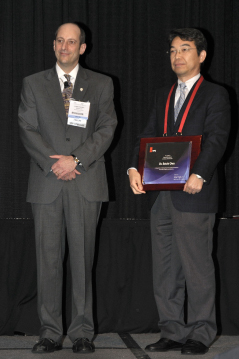 Soichi Owa with 2010 SPIE Advanced Lithography Symposium Chair Christopher Progler.